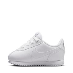 The Nike Cortez EasyOn Toddler Sneakers are easy like Sunday morning! They're simple to get on and will remain comfortable throughout the entire day. With their low profile, your child's feet and ankles can move, just how nature intended, as much as possible.Features: Features Nike Swoosh on side. Padded tongue and collar. Padded insole. Can slip on easily. Details:Lace-up and hook-and-loop. Easy Like Sunday Morning, Soccer Shop, Toddler Nikes, Adidas Tee, Black And White Sneakers, Toddler Sneakers, Wide Width Shoes, White Wolf, Backpack Sport