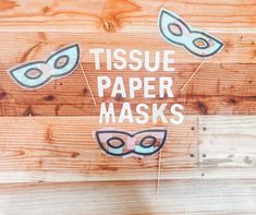 there is a sign that says tissue paper masks on the side of a wooden wall