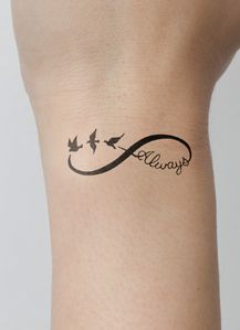 a woman's arm with a tattoo on it that says always and has birds flying around