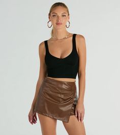 Babe, this faux leather mini skort is totally worth it! Featuring a sleek mid-rise waist, a front skirt overlay with a ruched seam, a bodycon silhouette, and shorts lining. Style with a best-selling corset top and heels to complete the look for a night out! Fit & FeaturesMid-rise waistBack zipper and hook-eye closureFront skirt overlay, ruched seamBodycon silhouetteMini-length, shorts liningFaux leather fabric, minimal stretchRuns true to size Faux Leather Mini Skirt For Date Night, Fitted Faux Leather Shorts For Night Out, Chic Faux Leather Skort For Night Out, Chic Fitted Faux Leather Skort, Faux Leather Fabric, Leather Fabric, Trending Now, Corset Top, Leather Mini