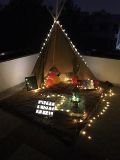 a teepee with some lights on it