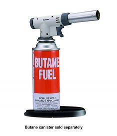 a red canister with a black base and white top that says butane fuel