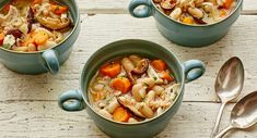 three bowls filled with soup on top of a wooden table