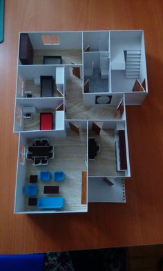 an overhead view of a model house on a table