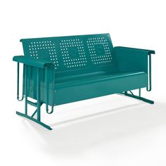 a green metal bench sitting on top of a white floor