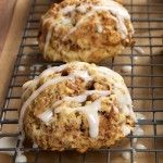 three muffins sitting on top of a cooling rack