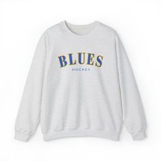 Blues fans! Cheer on your favorite team in style with this comfortable and stylish crew neck sweatshirt. Made from high-quality materials, polyester and cotton, this sweatshirt is perfect for showing support to your team in the stands or from the comfort of your own home. The collar is ribbed knit, so it retains its shape even after washing. There are no itchy side seams on these sweaters. - Gildan brand - 50% cotton, 50% polyester - Medium-heavy fabric (8.0 oz/yd² (271.25 g/m - Loose fit - Sewn-in label - Runs true to size - If going for an oversized look - size up! **Love our crew neck sweatshirt but want it in a different color? Contact us and let us know! We offer a range of color options and we'd be happy to work with you to create the perfect sweatshirt. Just send us a message with y Knicks Sweatshirt, Blue Crewneck, Soccer Fans, Colored Contacts, Favorite Team, Sew-in Labels, Heavy Fabric, San Jose, Crewneck Sweatshirt