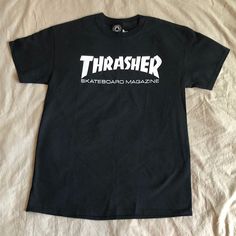 Black Thrasher Shirt Brand New Size: Medium Black Tops With Logo Print For Skateboarding, Black Logo Print Top For Skateboarding, Urban Black T-shirt For Skateboarding, Black Urban T-shirt For Skateboarding, Black Crew Neck Top For Skateboarding, Black Urban Tops For Skateboarding, Black Letter Print T-shirt For Skateboarding, Black Short Sleeve T-shirt For Skateboarding, Black Graphic Tee For Skateboarding