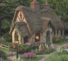 a painting of a cottage with flowers and trees in the background