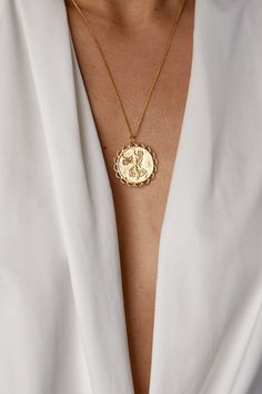 Necklace is gold plated with a 24 inch chain. You can returns or exchange up to 30 days. Email info@wearkorai.com for details. Gold Coin Necklace With Zodiac Sign, Gold-plated Zodiac Sign Necklace, Gold Zodiac Sign Pendant Necklaces, Gold Zodiac Pendant Necklace, Gold Plated Zodiac Medallion Jewelry, Gold Medallion Necklace, Gold Medallion, Medallion Necklace, Long Torso