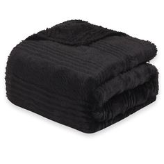 the black blanket is folded on top of each other