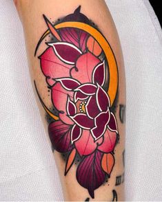 a person with a flower tattoo on their leg