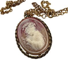 This exquisite vintage Victorian-style cameo pendant necklace is adorned with intricate floral detailing, capturing a timeless elegance reminiscent of a bygone era. Its delicate craftsmanship is evident in the finely carved cameo, exuding a sense of grace and sophistication. The gold-tone chain adds a touch of luxury, making it an elegant accessory that complements any refined wardrobe. * Oval-shaped pendant design * Intricate floral detailing * Gold-tone chain * Secure clasp closure Pendant measures approximately 2 inches in height. Chain length is 24 inches. Cameo Pendant Necklace, Vintage Cameo, Cameo Pendant, Vintage Victorian, Pendant Design, Elegant Accessories, Victorian Style, Victorian Fashion, Chain Lengths