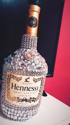 a bottle of hennessy gin on a table