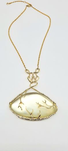 "Lucite Pendant Necklace, Alexis Bittar Pendant Necklace, Gold Branch Necklace, Clear Lucite Pendant, Lucite Rhinestone, Ophelia Vine Pendant Measurements: 18\" with 3.25\" extender chain. Pendant is 3.5\"L by 3\"W. Metal: 10k Gold Tone over Brass Findings: Lobster Claw Clasp Finish: Polished Excellent Condition When it comes to Lucite you cannot possibly do better than the creator of hand carved Lucite jewelry himself, Alexis Bittar. If you are not familiar with Lucite, it has the most beautiful natural glow that when combined with gold metal brings a luminescent warmth to the face. This STUNNING and LARGE (3.5\"L by 3\"W) clear Lucite pendant has been brought out of the Alexis Bittar collectors vault and straight to you! On top of the east west set Lucite sits high polished 10kt gold ton Diamond Gemstone Necklace For Evening, Evening Diamond Gemstone Necklace, Exquisite Formal Necklace With Large Pendant, Elegant Crystal Necklaces With Stone Setting, Formal Pendant Necklaces With Stone Setting, Gold Gemstone Necklace For Evening, Yellow Gold Jewelry With Gemstone Accents For Evening, Evening Yellow Gold Jewelry With Gemstone Accents, Elegant Yellow Gold Crystal Necklaces