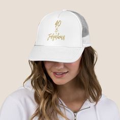 a woman wearing a white trucker hat with the word bride printed on it's front