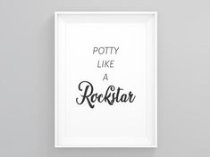 a white framed poster with the words potty like a rockstar in black ink