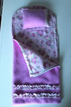 purple and white cloth with flowers on it