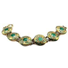 Browsing on a cell phone? Click Read Item Description for item specifics & policies. On a PC? Click Learn More About This Item. Item: This is a vintage Irish Celtic link bracelet with green enameling. It's in very good condition and is and has a spring ring clasp. Click Add To Cart to Buy this, click the Heart button to Favorite, and check our other listings for lots more antique and vintage jewelry! Signature: Unsigned Measurements: 7/8" wide, total circumference 7 1/4" Condition: 9 - Very good, light patina and wear consistent with age Shipping: U.S. shipping is $5.00 for USPS First Class Mail with Tracking. Faster Insured Priority Mail upgrade optional at checkout. International First Class Mail is $18.50, Canada $14.95. Our No RegrEtsys Guarantee: Wrong size? Not what you expected? Wha Vintage Black Enamel Bracelet Jewelry, Antique Gold Enamel Bracelets, Vintage Black Enamel Bracelet, Antique Enamel Bracelet Jewelry, Antique Enamel Bracelet For Formal Occasions, Antique Enamel Bracelets For Formal Occasions, Art Deco Green Bracelet For Formal Occasions, Vintage Black Enamel Bracelets For Formal Occasion, Art Deco Green Bracelets For Formal Occasions