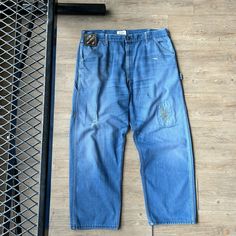 VINTAGE 80s ' Sun Faded WorkWear Baggy Jeans Pants sz W38 L30 CONDITION : Wear and fading from age. Mended / repaired tears* Marks/ stains throughout. Overall good distressed condition! These pants have been washed* - Please review pictures* TAGGED SIZE : ** Adult Mens W38 L30* ( Fits : Mens W38 L30 ) MEASUREMENTS : *Please see photos above for measurements. *Disclaimer: All measurements are in inches and are taken laying flat on the ground* * Waist measurement taken hip to hip * Length measurem Vintage Baggy Jeans With Pockets, Vintage Baggy Straight Leg Jeans, Vintage Baggy Denim Pants, Vintage Wide Leg Jeans For Streetwear, Retro Baggy Washed Bottoms, Retro Medium Wash Pants With Pockets, Vintage Baggy Faded Bottoms, Vintage Baggy Bottoms With Pockets, Vintage Streetwear Bottoms For Spring