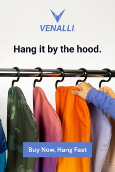 a young boy is trying to hang his clothes on a rack with the words, hang it by the hood buy now, hang fast