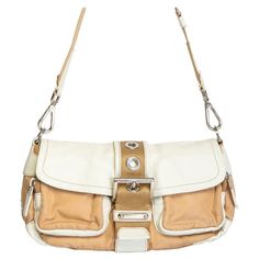 Designer Beige Flap Shoulder Bag, Designer Beige Flap Bag With Removable Pouch, Designer Beige Flap Bag With Detachable Strap, Designer Cream Shoulder Bag With Detachable Strap, Beige Flap Bag With Gold-tone Hardware, Modern Beige Flap Shoulder Bag, Cream Shoulder Bag With Leather Trim, Designer Cream Shoulder Bag With Adjustable Strap, Designer Beige Satchel With Adjustable Strap