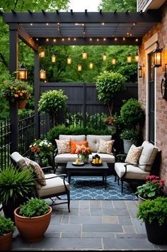 an outdoor patio with seating and potted plants