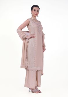 Arya Georgette Tiki Resham Embroidered Palazzo Suit. Readymade premium georgette fabric Enhanced with tiki & resham embroidery work Comes with dupatta, palazzo pants Sleeves attached as per image. Experience elegance and comfort with our Arya Palazzo Suit. Made with high-quality georgette fabric and featuring stunning Tiki Resham embroidery, this suit is perfect for any occasion. The palazzo pants provide a relaxed fit and added convenience.