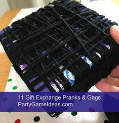 a person holding up a black piece of cloth with colorful designs on it and the words 11 gift exchange pranks & gags party games com