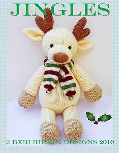 a knitted stuffed animal with a scarf on it's head and the words jingles dk yarn written below