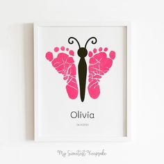 a pink and black butterfly with the name oliva on it's wings