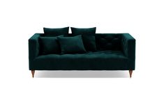 a green couch with four pillows on it