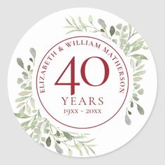 an anniversary sticker with the number forty years printed on it, and green leaves