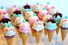 there are many ice cream cones with sprinkles on them