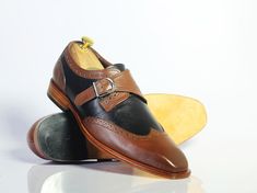 Handmade+Brown+&+Black+Wing+Tip++Monk+Straps+Leather+Shoes+For+Men's  +  Brand+Leather+Edges  Running+Size+USA+Size+  Features+Handmade+Hand+Stitched  Material+Leather+  Leather+Sole  Color++Brown+Black  Interior+Soft+Leather+Lining  Pattern+Solid+Dress+Shoes  Product+Line+Made+In+Pakistan  Style... Luxury Leather Monk Strap Shoes For Derby, Luxury Wingtip Monk Strap Shoes With Textured Sole, Luxury Wingtip Monk Strap Shoes With Leather Lining, Luxury Wingtip Monk Strap Shoes In Calf Leather, Luxury Elegant Wingtip Monk Strap Shoes, Luxury Wingtip Monk Strap Shoes With Rubber Sole, Luxury Wingtip Slip-on Monk Strap Shoes, Luxury Wingtip Monk Strap Shoes For Business, Luxury Timeless Wingtip Monk Strap Shoes