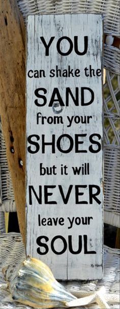 a sign that says you can shake the sand from your shoes but it will never leave your soul