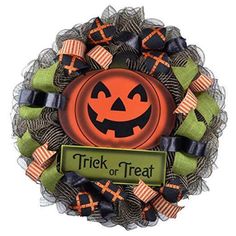 a halloween wreath with a trick or treat on it