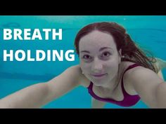 a woman swimming underwater in a pool with the words breath holding above her head