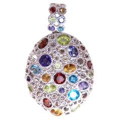 Assorted natural gem egg-shaped pendant. Amethyst, citrine, blue topaz, garnets, and peridot Total weight 4.20 carat. Round cuts. Measures 38x24mm Depth 7mm 14 karat white gold 8 grams Blue Gold, Blue Topaz, Citrine, Womens Jewelry Necklace, Garnet, Topaz, Jewelry Necklace Pendant, Egg, Amethyst