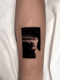 a person with a black and white photo on their arm