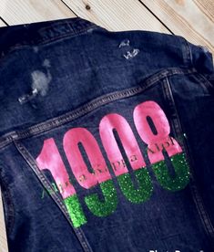 This custom designed inspired Alpha Kappa Alpha Jacket is an iconic show stopper. This denim style jacket is durable, thick and comfortable. Please keep in mind that ALL items are CUSTOM MADE TO ORDER. Please allow 7-10 business day for production and shipping. As always, thanks sew much for supporting my business.  *100% Denim *Machine Washable *Regular Fit *All orders are CUSTOM created *Hooded *Button Up Trendy Customizable Outerwear For Spring, Alpha Kappa Alpha Jackets, Alpha Kappa Alpha Clothing, Aka Sorority, Custom Denim, Sorority Life, Alpha Kappa Alpha, Blue Jean Jacket, Denim Style