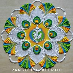 an intricately designed rangolii with peacocks on it