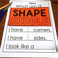 an orange and black shape riddle on top of a piece of paper