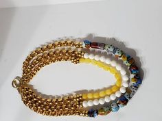 "Beautiful vintage Murano glass beads and dyed jade beads create a one of a kind necklace. Gold rings add shine to the top half of each strand. The necklace has a toggle clasp. ●Dimensions: L:22\" ●Linda's Designers Group features a collection of unique fine china, luxury estate sale handbags, vintage statement jewelry and handmade 'one of a kind' jewelry. We will gladly provide additional images or information, contact us through this site or our Facebook page. Follow us on Facebook and Instagr Luxury Glass Jewelry With Large Beads, Luxury Glass Jewelry With Round Beads, Glass Multi-strand Jewelry With Large Beads, Multi-strand Glass Beaded Jewelry, Multi-strand Glass Bead Jewelry, White Czech Glass Beaded Chain Necklace, White Glass Beaded Necklace With Large Beads, White Bohemian Necklace With Czech Glass, White Glass Necklace With Colorful Beads