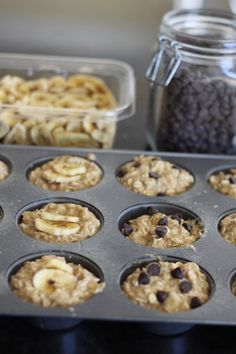 muffins with banana slices and chocolate chips in the middle are ready to be baked