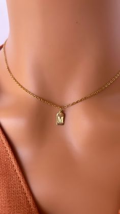 14K GOLD Initial TAG Necklace , Dainty Initial Necklace , Custom Letter Pendant Necklace , Gift for Mom , Bridesmaid Gift ,  Christmas Gift 📌Materials: 14K Gold , Silver 📌Free Shipping 📌Waterproof 📌*Hypoallergenic You can wear gym, pool, shower or everywhere . 📌Anti tarnish  MATERIAL & SIZES ** Dainty Chain :14K Gold Filled over Stainless steel 14K GOLD PLATED TAG  LETTER SIZE : 5.5 MMX 9.5MM ------------------  If you would like to SILVER TAG INITIAL NECKLACE , follow the link below.  http Gold Jewelry With Initials For Gifting, Gold Jewelry With Initials For Gift, Gold-tone Pendant Charm Necklaces For Gifts, Gold Initial Necklace With Charms For Gift, Gold Initial Necklace With Charms As Gift, Gold Initial Pendant Necklace For Wedding, Gold Initial Pendant Necklace For Gift, Gold Initial Pendant Name Necklace As Gift, Gold Initials Necklace For Gift