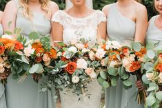 the bride and her bridesmaids are holding their bouquets in front of each other