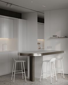 two stools are sitting at the bar in this modern kitchen