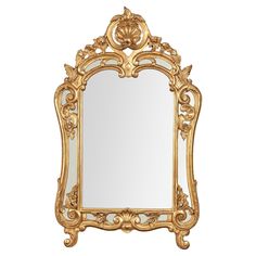 an ornate gold framed mirror on a white background