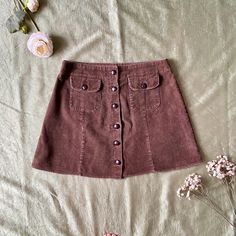 Adorable 90s does 60s vintage preppy a line brown corduroy mini skirt with little front pockets and chunky buttons all the way down. Adorable for fall with chunky boots. Brand: IZ Size: vintage 13 Waist: 16in Hip: 20in Length: 16in In good vintage condition. Color may vary in photos and actual item Mini Rock, Corduroy Mini Skirt, Virtual Wardrobe, Vintage Preppy, Brown Corduroy, 60s Vintage, Chunky Boots, 90s Vintage, Vintage Brown